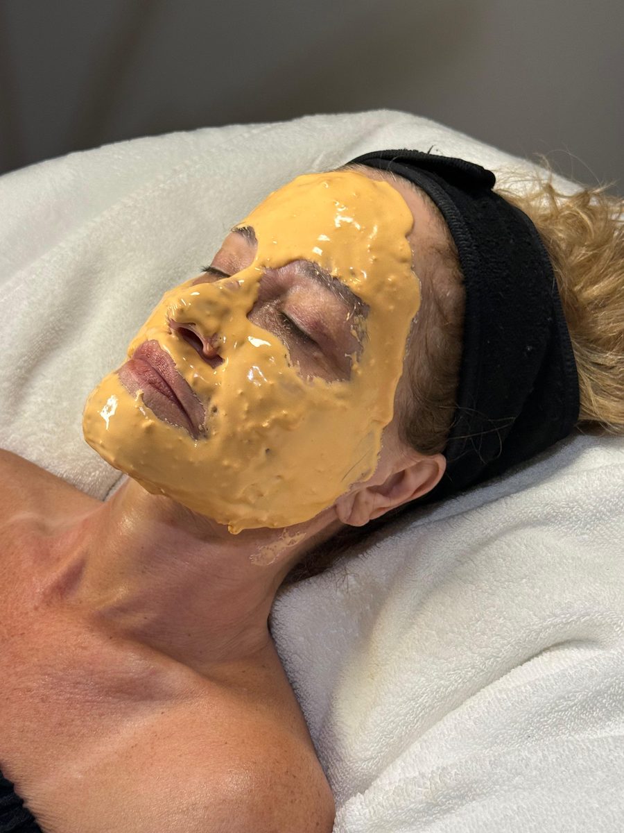 Patient during Pro-Nano Infusion facial with golden jelly mask add-on at Solace Wellness Aesthetics Fort Myers FL